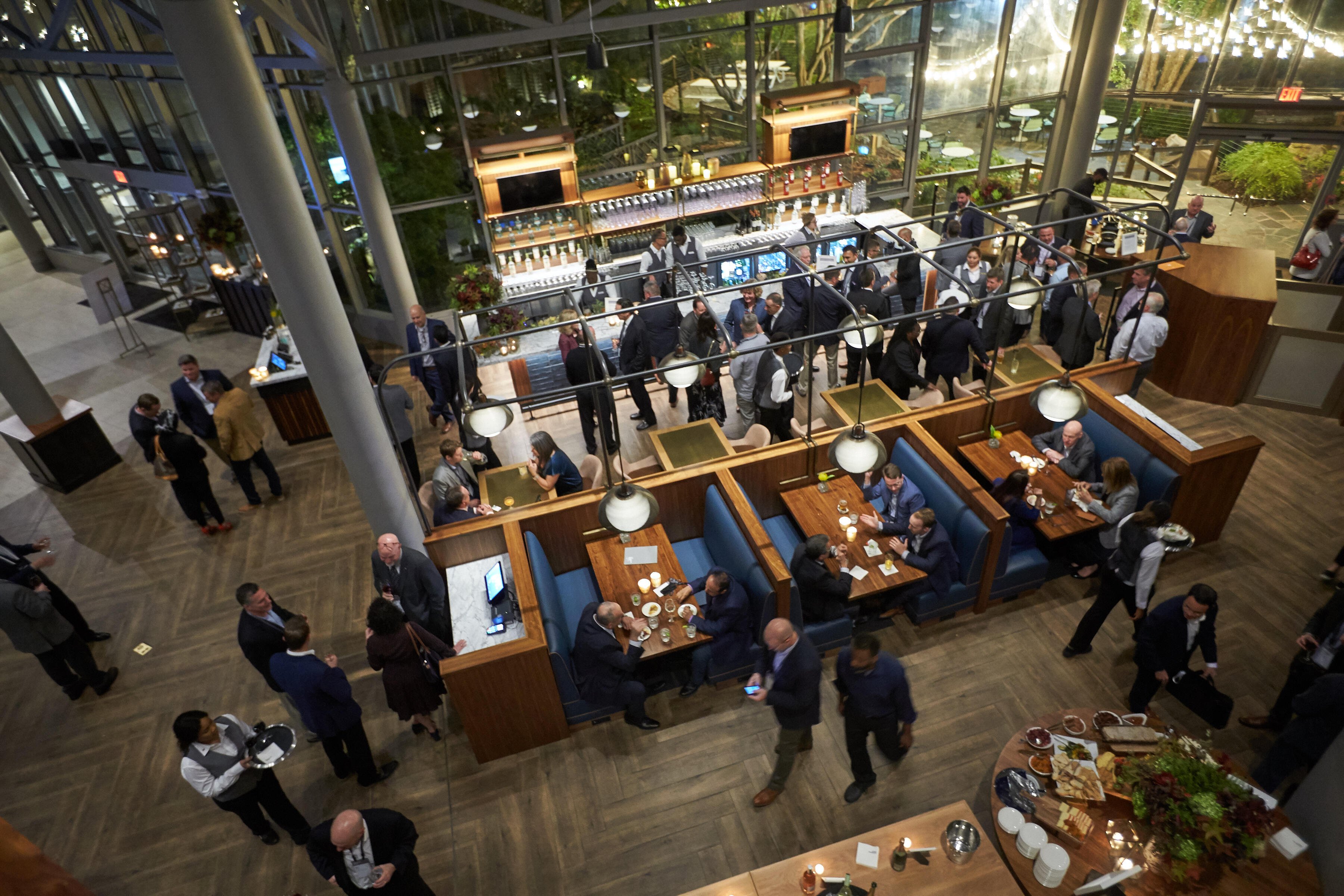 Overhead view of participants networking from Crowne Plaza corporate meeting event.