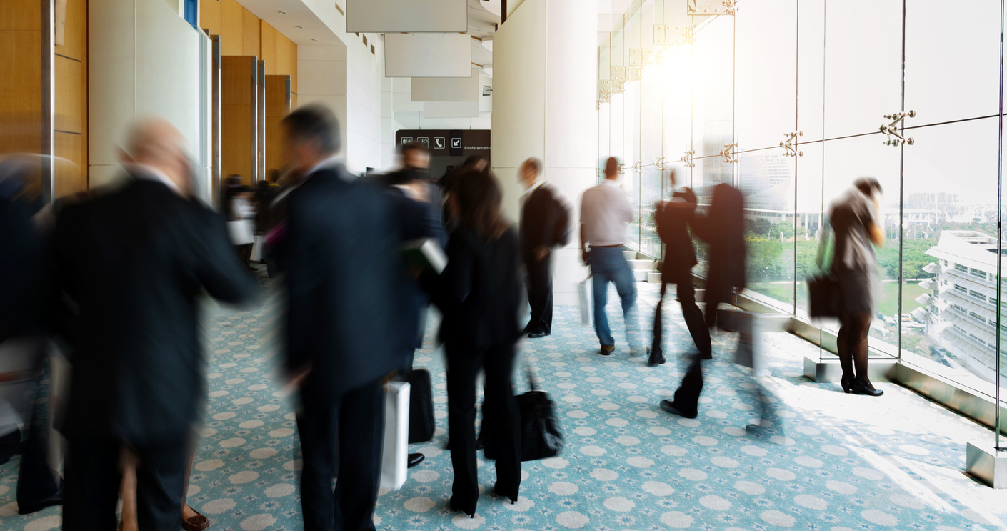 Business Professional Walking Through a Conference Venue 